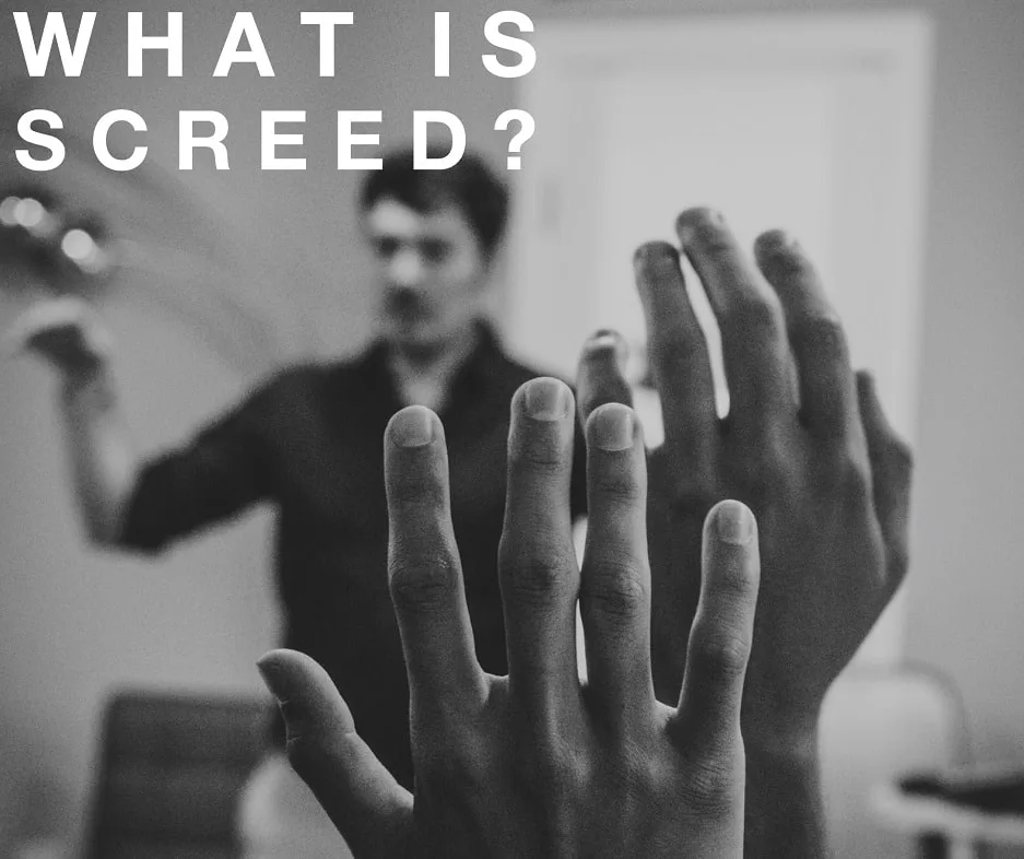 close up of raised hands in a classroom with text that reads what is screed_plastering and rendering services_gk rend